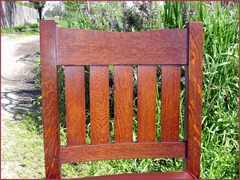Detail of the excellent quarter-sawn grain and the double pinned mortise and tenon constructed crest rail chair back. 